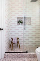 The girls’ bathroom features Concrete Collaborative Alabaster Large Pink Chip Terrazzo tile in a 12’ X 12" the floors. This is paired with Concrete Collaborative Strands tiles in the Pink Racing Stripe pattern on the shower walls.&nbsp;