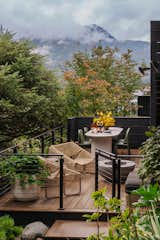 The home is surrounded by the natural beauty of Juneau. "Privacy and sightlines are key considerations when designing outdoor spaces," says Jason Clifton, principal designer at Bauer/Clifton Interiors. "We incorporated a mix of railing styles for this deck, including a privacy wall screen and more transparent railings in areas where privacy wasn’t needed, so the design feels cohesive and intentional."