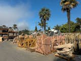 At the rock yard, huge trucks were being filled with slate, flagstone, and boulders by the ton. I picked out a three-foot-wide piece for about $40.