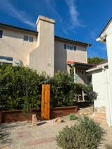 As you can see, even with an enclosure, that would have left us exposed to the two-level home that peers into our yard. Placing the shower against the hedges provides complete privacy from the next-door neighbor, even if it doesn’t look like it here.