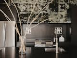 Salvare mirror prints act as a shimmering contrast in the all-black kitchen. <b>[Is Salvare a brand?]</b>  Photo 9 of 17 in Budget Breakdown: Three Friends Build a $940K Home Near Joshua Tree That Breaks With Boho Vibes