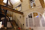 The view from the main living space shows how the architects were able to retain the barn’s original walls and beams. 