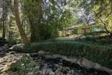 The Sounds of a Creek Fill This $1.4M Midcentury in North Vancouver - Photo 9 of 9 - 