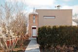Asking $10K a month, this ’90s home might look like a monolithic fortress—but the interior plays with pastel tones and a cloud motif.