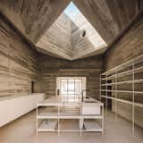 An immense skylight is set above the kitchen island.