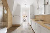 The primary bathroom features both a Juliet balcony and a steam sauna.