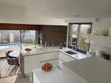 The interiors step down the&nbsp;hillside in a series of half stories leading to the backyard.