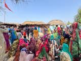 Women from Pono greet a visiting group of builders from Malawi, who traveled to Pakistan to learn bamboo construction techniques.