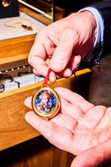 A pendant/watch face, created by the artist Cindy Sherman, features her iconic fortune-teller guise on the face and the clock, embedded in the crystal ball. This piece was designed as a one-off for Barney’s New York’s AMFAR partnership in 1993, with all proceeds going to AIDS research.