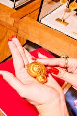 There’s no real reason anyone needs a solid gold paperweight that’s a snail with a little finger poking out of the shell, but there’s also no real reason why you don’t. 