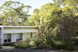 At the front of the house are large bedroom windows, which were initially exposed to the street. “We’ve got sun-loving plants like coral bark Japanese maples, swamp banksia, lilly pilly, and grevilleas to provide shelter and privacy to the house,” says Graham.