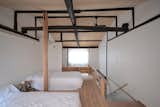 Exposed, structural charred cedar beams run throughout the house.