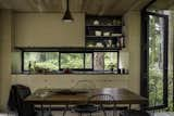 Bertoia side chairs and an Aplomb pendant by Foscarini complete the dining area.