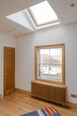 The home has twelve skylights, including this one in an upstairs bedroom.