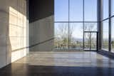 The main room has seven-meter-high ceilings with southeast-facing floor-to-ceiling windows.