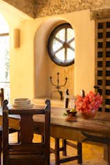 In the dining room, an old wheel was made into a window.