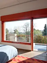 Steps lead down to the pool, but the more daring way to enter it—as the architect intended, says Fabian—is by climbing over the primary bedroom’s balcony gate and diving or jumping into the deep end below. “It was one of the first swimming pools in the area,” says Roberto. “The owners were open and friendly, so all the neighbors would come and use it.” Besides providing alternative access to the pool, the bedroom offers an unobstructed view of the surrounding countryside.
