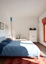 The couple’s bedroom exemplifies their unpretentious approach to furnishing. “We didn’t want to make the rooms overcrowded,” says Fabian. “We wanted to keep everything easy, simple, and open.”