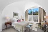 Four bedrooms are located in the main house, and there are three in the guesthouse and one in the caretaker’s studio.