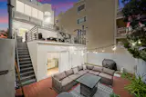 The home has numerous outdoor spaces—there are decks and patios out front, behind the home, and on the roof.