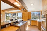 Much of the house is original, including the slate floors, stainless-steel counters, kitchen cabinets, and patio doors.