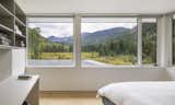 The bedrooms on the upper floor have framed views of the landscape and ample built-in millwork.