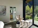 A reading nook in the primary bedroom suite benefits from direct access to the patio.