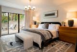 The primary suite opens to a front yard patio.