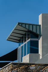 Concrete, glass, and metal form the building’s exterior envelope. "Part of what allowed us to build what we wanted with all the glass, is because of the concrete," says Bata. "Of course the concrete absorbs heat, so that would keep you warm in the wintertime, and then in the summertime when we'd run the air conditioning, that'd cool off the floor and be quite comfortable." In addition to concrete, the metal roof—sometimes know as a "cool roof"— offers high reflectivity coating and large overhangs, which help keep the interior comfortable and reduce utility costs.