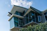 The dining room, enclosed in glass, is cantilevered over the hillside.