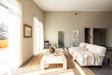 The living room features double-height ceilings and heated, polished concrete floors.