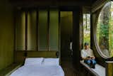“There are a lot of cool and very beautiful cabins being designed, but they all look alike,” Pérez Rea Juncá says. “The generic wooden cabin—it’s always this natural-pine tone,” says Germenos Garcia. The O-Frame uses pine plywood for the walls and ceiling and uses treated pine planks for the floor, but it’s all stained in dark and earthy colors.