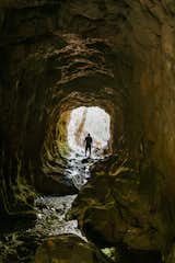 “It rains, like, every day here for six months,” says Santiago Garcia Rey, Wander Cabins’ founder. All that precipitation fuels plenty of local water features, such as a stream that runs through a tunnel to a waterfall.