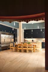 The kitchen and dining area of Anduhyaun, a shelter for Indigenous women in Toronto designed by LGA Architectural Partners, is filled with natural light from the adjacent garden and firepit. “Not all shelters understand the role that the building can play in supporting what the community is trying to do,” says James.
