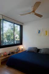 The bed, bookshelf, and more furniture in the bedroom is by Abigail Turin.