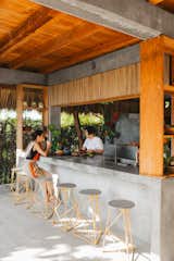 Lasala joins her for coffee at the poured-concrete kitchen counter. The stools were designed by Deborah and made by Mendoza. “I’d still love to finish some stuff,” says Deborah, “but I think the house right now feels pretty much as it should be.”