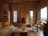 The new addition echoes the features of the existing home, including lit alcoves for displaying ceramics and other objets d’art. The Kiva fireplace is inspired by the look of the original wood-burning fireplaces, but is powered by gas to meet modern regulatory standards.