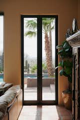 The 10-foot-high Modern Swinging doors in the living area were ideal for emphasizing the height of the space. "The biggest reason we chose the Marvin Modern collection is because of the simplicity of its frame and its ability to maintain and enhance the transitions between inside and out," says Michelle. "I could use the tall 10-foot-high doors without a transom above and really open the space up."