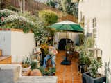 Roxana works in the garden, which will be altered but remain an important part of the home.