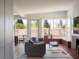 The tiled bench extends in front of the fireplace and down toward the entryway, creating a satisfying tie between the multiple different distinct areas of the open living space.  Photo 3 of 5 in How They Pulled It Off: A Built-in Tiled Bench That Honors the View