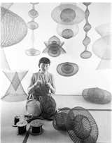 Asawa, pictured in 1954, works on a large-scale sculpture.