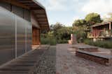 In Fingal Head, New South Wales, Australia, Blankslate founders Nigel Chouri and Crick King completely reenvisioned a ’50s beach shack and its garage. They spent $911K for the property, and $322K on the renovation. The two structures are connected by a plaza defined by recycled bricks.