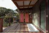 A bathtub is built into the deck off the bedroom, offering another moment of retreat.