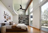 The home aims to connect with the surrounding landscape using soaring windows and double-height ceilings.