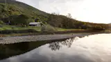 The home sits on a bank of the Kings River.