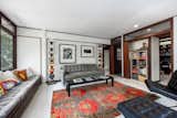 A smaller family den sits down the hall from the main living room.