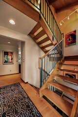 An oak stairwell spans the home’s three floors.