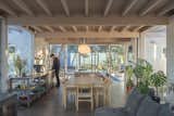 “The material palette is the same for the entire house,” says architect Daniel Iragüen, pointing out the porcelain tile floors, laminated pine ceilings, and whitewashed pine slats that form the interior walls.