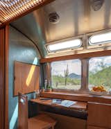 The wooden according panel on the wall conceals controls for the trailer.