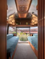 The trailer uses Wright’s effect of compression and release, with a tight hallway opening up to the dinette at the front and the bedroom at the rear.